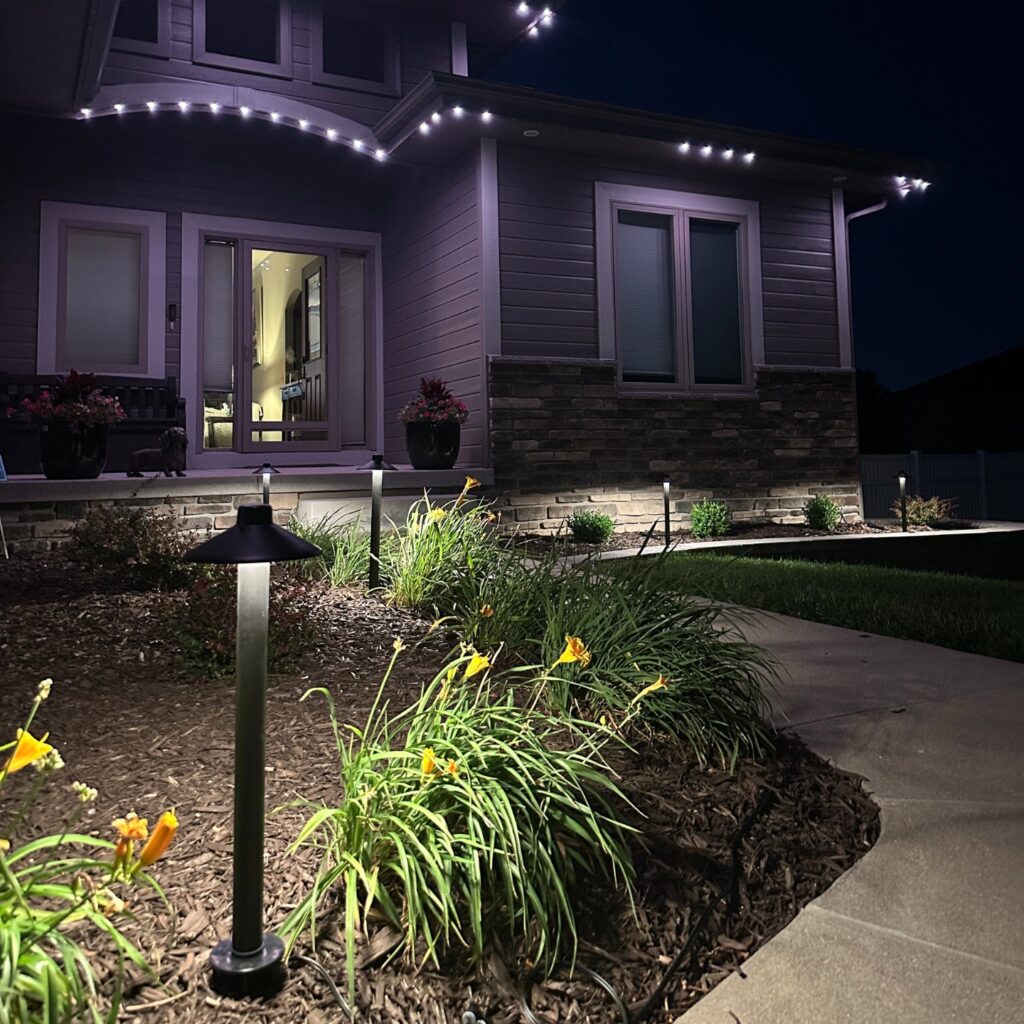 Pathway and walkway lighting installed along a residential front walkway for safety and curb appeal